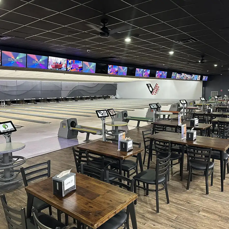 Empty bowling lanes and dining tables inside Victory Lanes in Decatur, IL