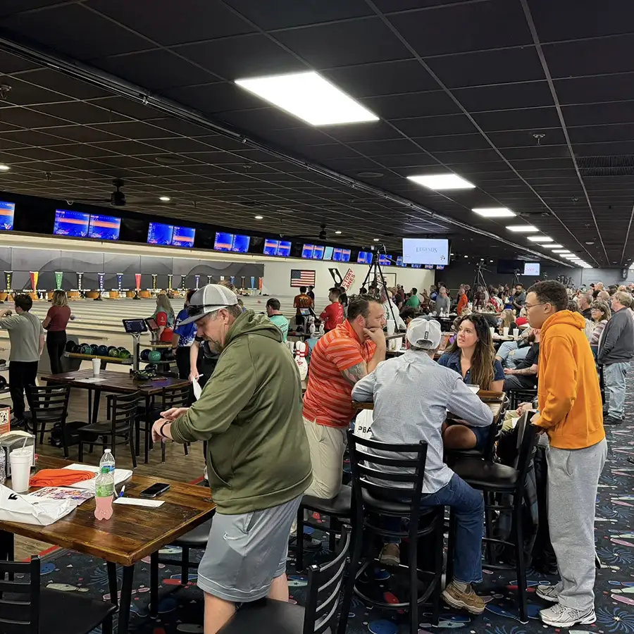 Crowd of guests gathered at tables during a bowling event at Victory Lanes in Decatur, IL