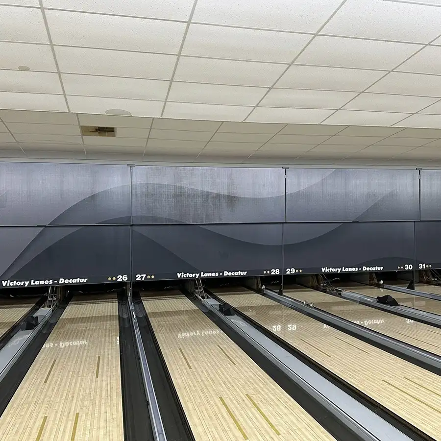 Rows of empty bowling lanes numbered 26 through 31 at Victory Lanes in Decatur, IL